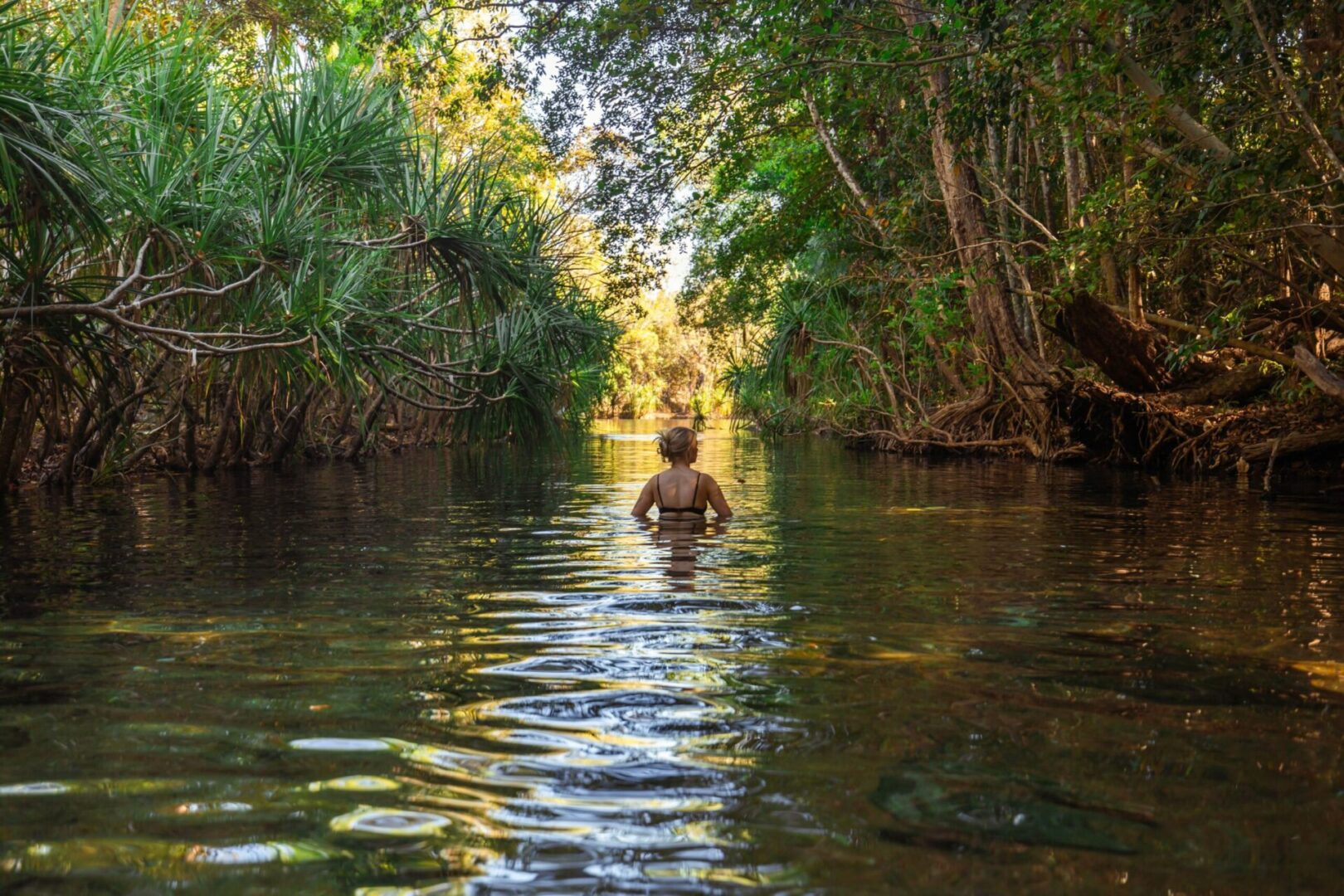 Girl looking down the creek at Berry Springs