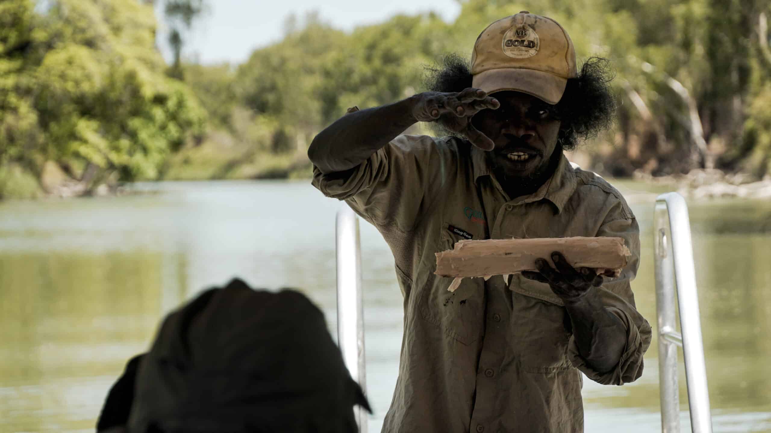 aboriginal man holding a piece of paperbark in Kakadu